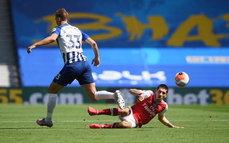 Arsenal's Hector Bellerin in action with Brighton & Hove Albion's Dan Burn. Reuters