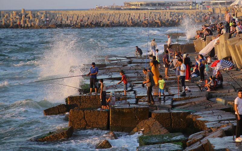 Locals fish in the Mediterranean Sea near the Citadel of Qaitbay during the summer holiday season in the coastal city of Alexandria, Egypt. EPA
