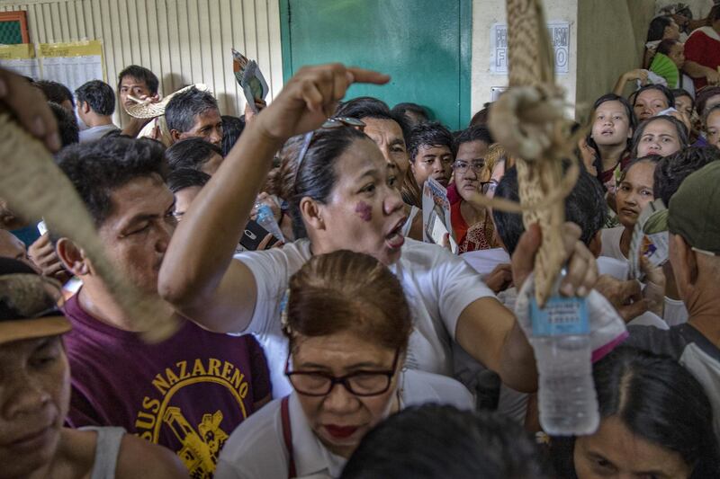 Filipinos crowd a polling station  in Manila. Getty Images