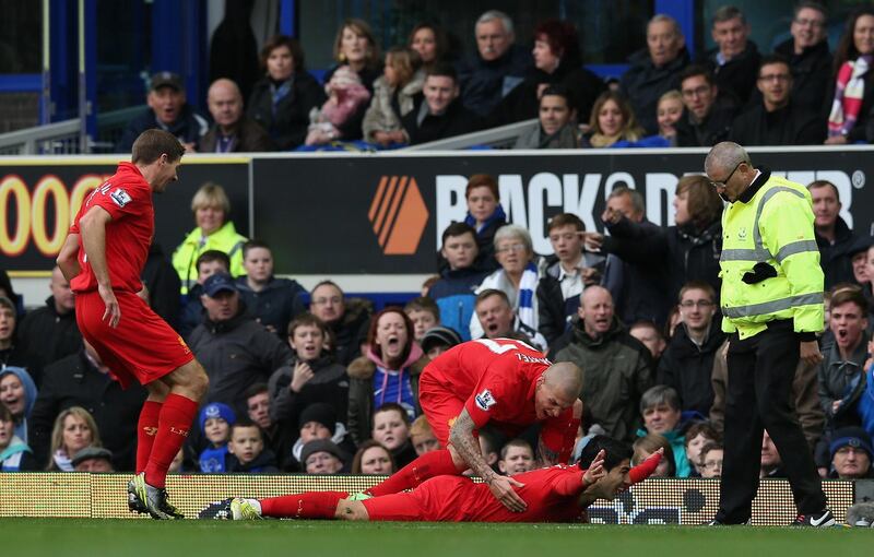 LIVERPOOL, ENGLAND - OCTOBER 28:  Luis Suarez of Liverpool celebrates scoring the opening goal during the Barclays Premier League match between Everton and Liverpool at Goodison Park on October 28, 2012 in Liverpool, England.  (Photo by Clive Brunskill/Getty Images)