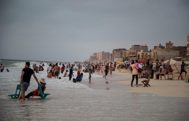 Egyptians visit the beach near Alexandria. EPA-EFE
