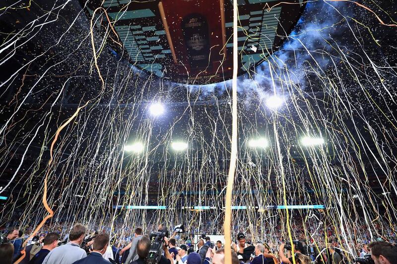 Confetti falls as the North Carolina Tar Heels celebrate after defeating the Gonzaga Bulldogs during the 2017 NCAA Men’s Final Four National Championship game at University of Phoenix Stadium in Glendale, Arizona. The Tar Heels defeated the Bulldogs 71-65. Tom Pennington / Getty Images / AFP