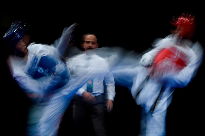 Taiwan's Huang Yujen competes against Saudi Arabia's Ghazi Mushabbab Alasmari during the taekwondo round of 16 at the 2018 Asian Games in Jakarta, Indonesia. AFP