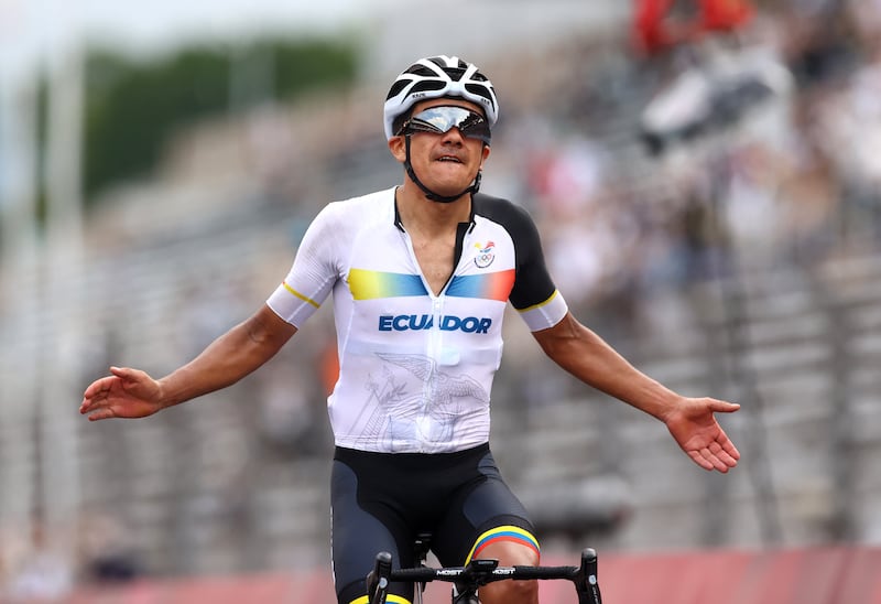 Richard Carapaz of Ecuador celebrates winning gold in the Men's Road Race.