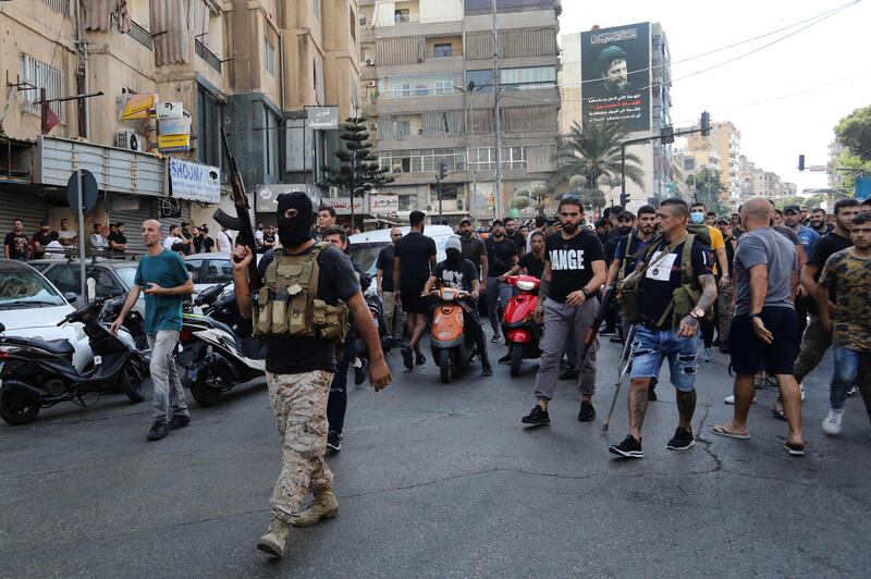 Hezbollah supporters attend the funeral of members killed during clashes in the Tayouneh neighbourhood of Beirut. AFP