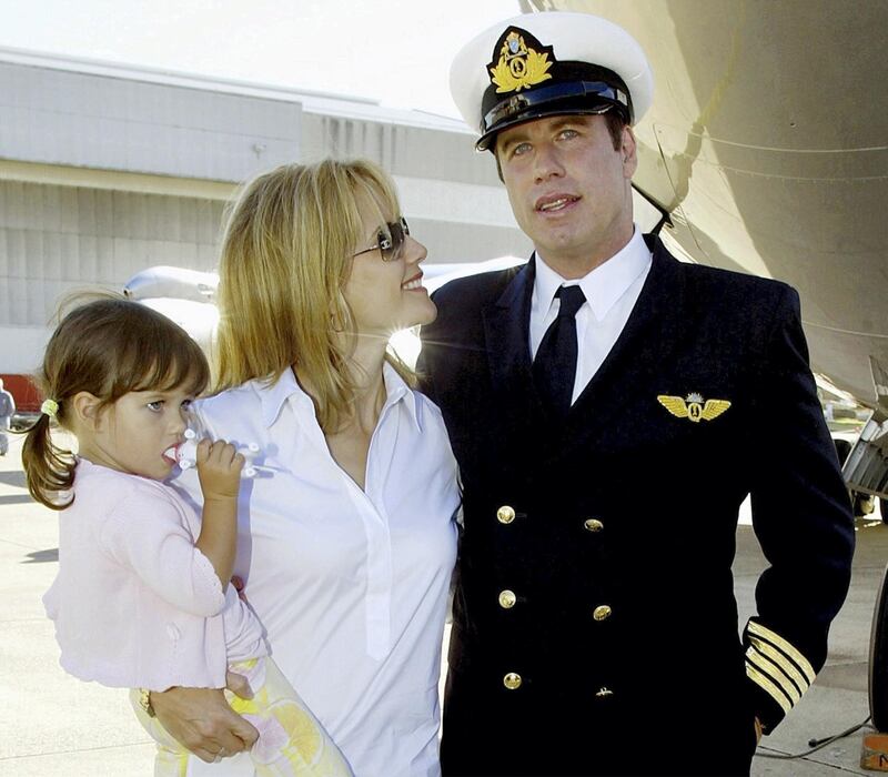 U.S. movie star John Travolta stands with his wife Kelly Preston and their
two-year old daughter Ella Bleu underneath his Qantas plane shortly after
arriving for a promotional visit to Sydney July 12, 2002. Travolta is
piloting his Boeing 707 jet, which was formerly a Qantas commercial jet,
around the world after he was recently named the airlines' "Ambassador at
Large". He and his crew will visit thirteen cities worldwide. REUTERS/David
Gray

DG/JD