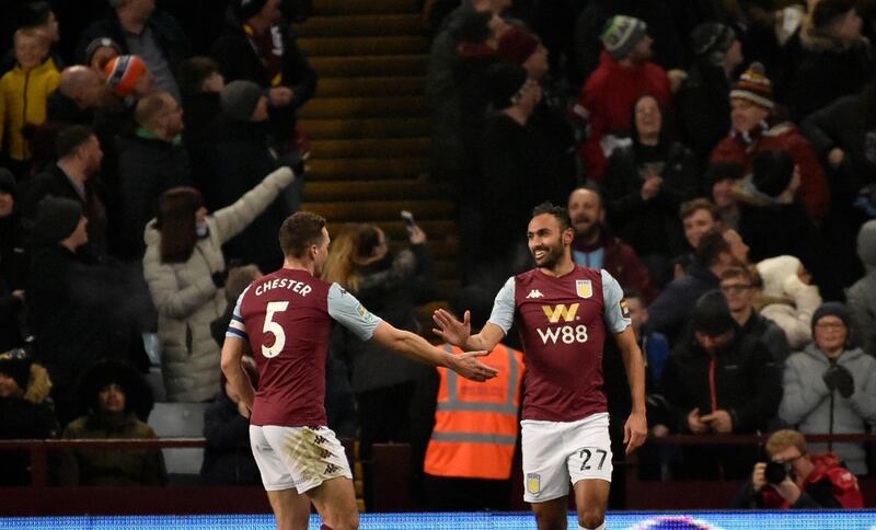 Aston Villa's Ahmed Elmohamady, right, celebrates with James Chester after Liverpool's Morgan Boyes scores an own goal. AP