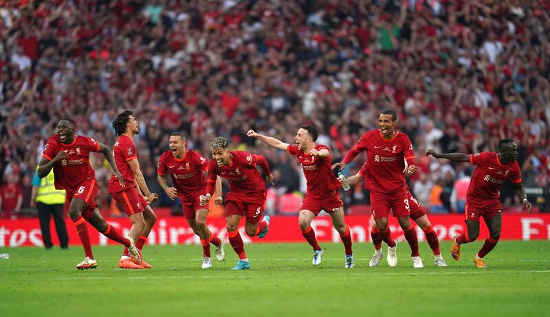 Liverpool celebrate winning the Emirates FA Cup. PA