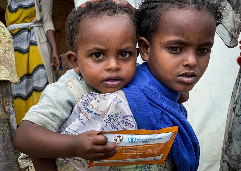Children receive aid from the World Food Programme in Tigray, where a civil war has displaced millions of people. AP