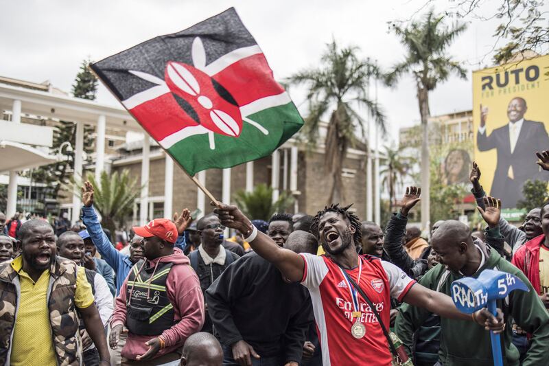 A supporter of the political coalition Azimio la Umoja waves a national flag, as Kenyans wait for election results in Nairobi. AFP