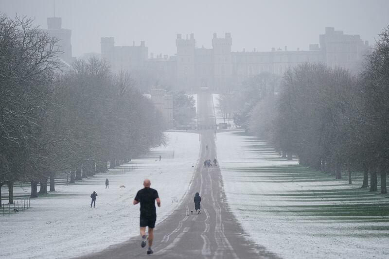 A jogger on the Long Walk towards Windsor Castle. PA