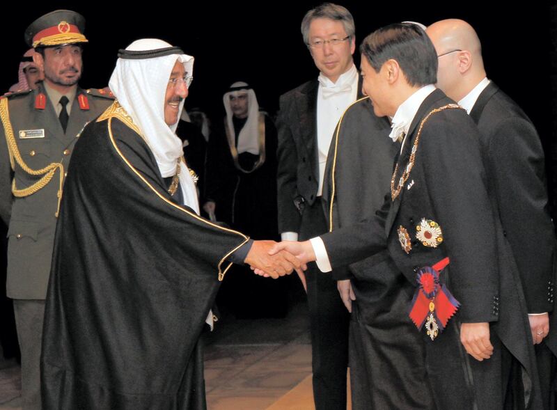 The Amir of Kuwait Sheikh Sabah Al-Ahmad Al-Jaber Al-Sabah is welcomed by Crown Prince Naruhito (R) prior to their official dinner at the Imperial Palace in Tokyo March 21, 2012. REUTERS/Itsuo Inouye/Pool (JAPAN - Tags: POLITICS ROYALS)