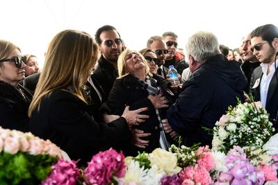 The aunt (C) and father (2ndR) of Mina Basaran one of the victims of a a plane crash over Iran mourn next to her coffin on March 15, 2018 during her funeral cerenomy in Istanbul.
Grieving families bade farewell to the young women killed in a plane crash over Iran while returning from a pre-wedding celebration for a Turkish businessman's daughter, in a tragedy that shocked the country. / AFP PHOTO / YASIN AKGUL