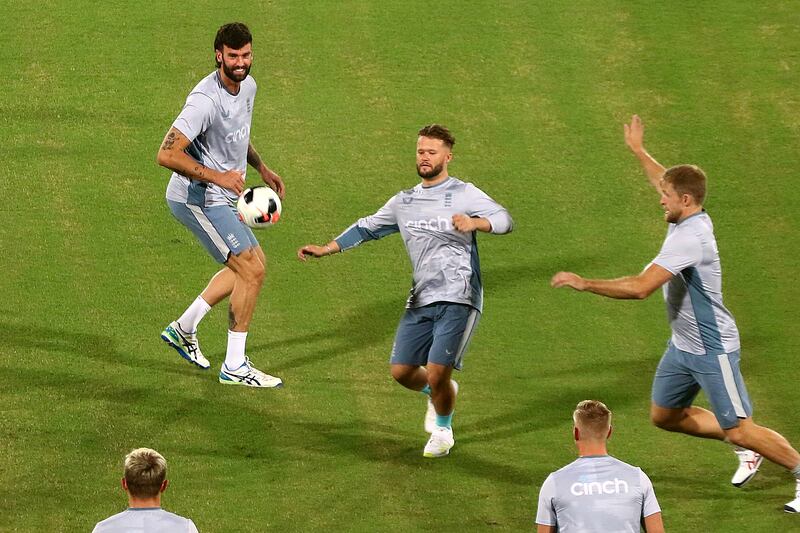 England's cricket team play football. EPA