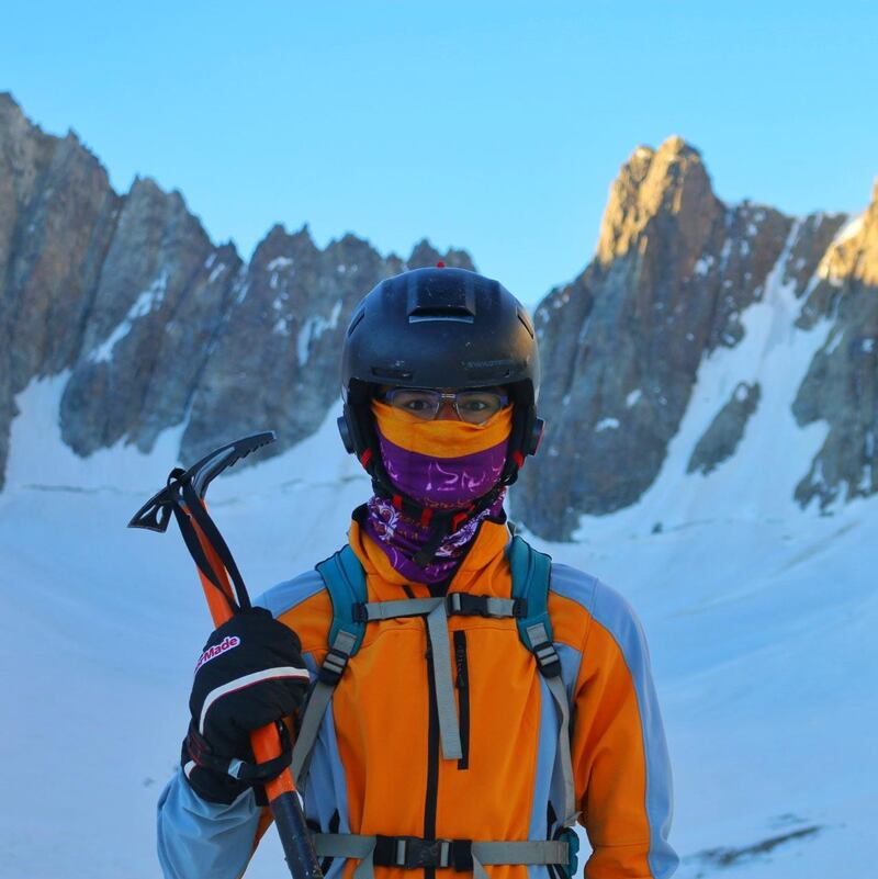 Zabih Afzali holding a pick axe on Mount Shah Fuladi in Bamiyan, June 2020. Courtesy Zabih Afzali