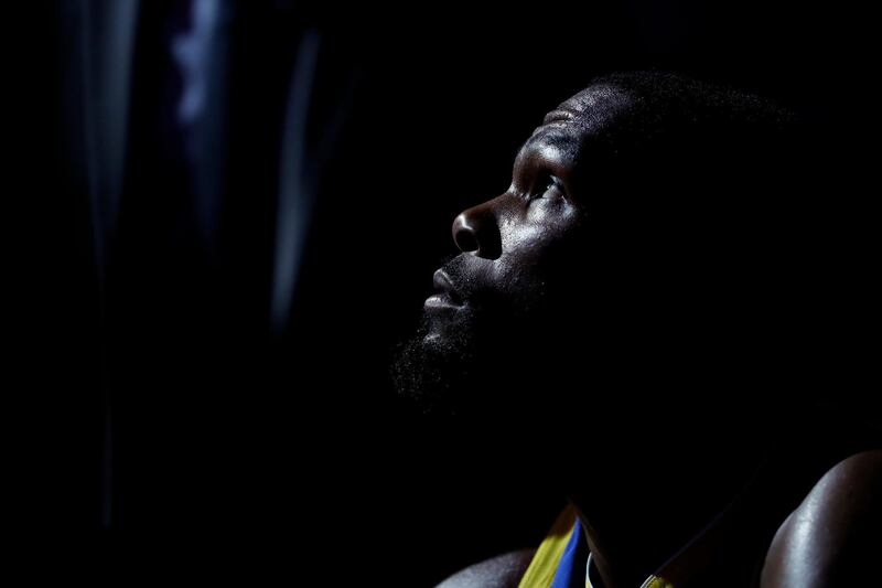 Golden State Warriors' Kevin Durant looks up as the team huddles during a timeout in the first half of an NBA basketball game in Philadelphia. AP Photo