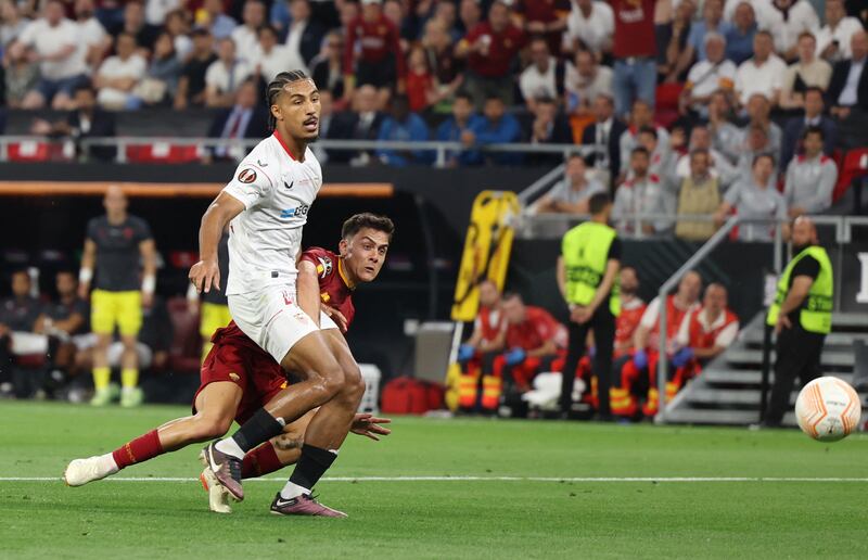 Roma's Paulo Dybala scores their first goal. Reuters