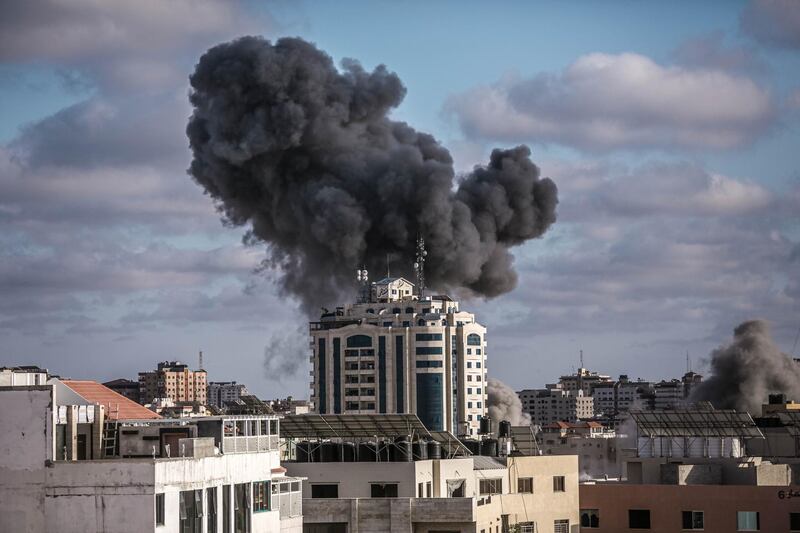 Smoke rises following an Israeli air strike on a building on May 17, in Gaza City. More than 200 people in Gaza and ten people in Israel have been killed. Getty