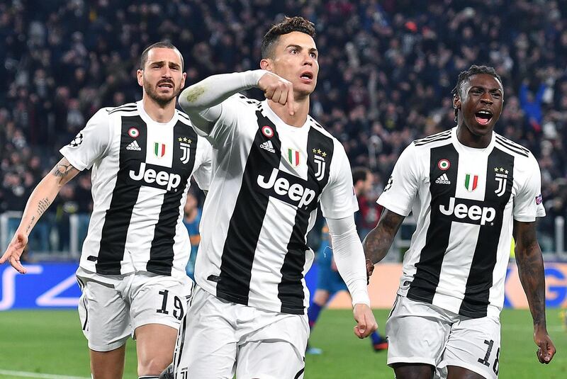 Juventus' Cristiano Ronaldo celebrates after scoring a penalty to make it 3-0 on the night and send the Italian side through to the Champions League quarter-finals 3-2 on aggregate. AFP