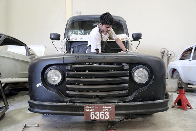 SHARJAH , UNITED ARAB EMIRATES ,  October 29 , 2018 :-  Worker working at the Rayans Rides car workshop at Emirates Industrial City in Sharjah. ( Pawan Singh / The National )  For Motoring. Story by Adam