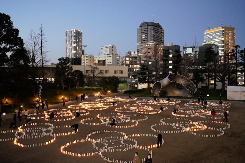 More than 2,000 candles have been used in a display to commemorate those killed by an earthquake and tsunami in Japan in 2011. EPA
