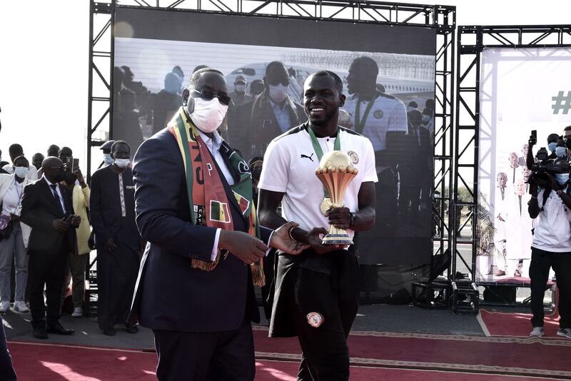 Senegal President Macky Sall, left, with Senegal captain Kalidou Koubaly in Dakar. AFP