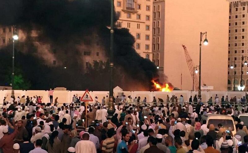 Muslim worshippers gather after a suicide bomber detonated a device at te Prophet's Mosque in Medina. Reuters