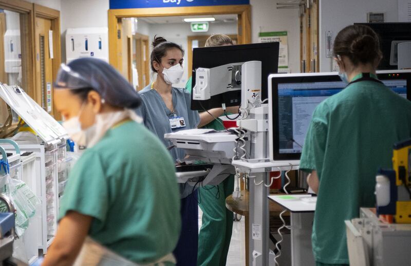 Staff nurses work in the corridor of the acute dependency unit at St George's Hospital in Tooting, south-west London, on April 14. PA