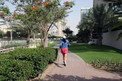 DUBAI, UNITED ARAB EMIRATES - APRIL 28:  A woman jogging in The Greens in Dubai on April 28, 2010. The Dubai Internet City Metro Station which is located close by, is one of seven new stations set to open on Friday, April 30, 2010.  (Randi Sokoloff / The National)  For A&L Oasis-Metro/and or Stock