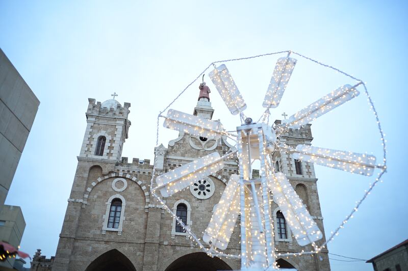 The Saint-Estephan church in Batroun is seen through a Christmas decoration.