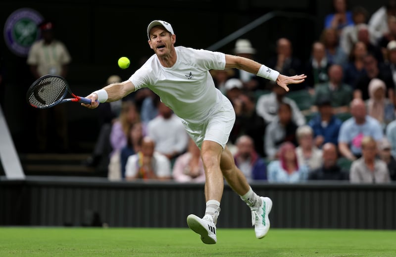 Andy Murray stretches to play a forehand to James Duckworth. Getty