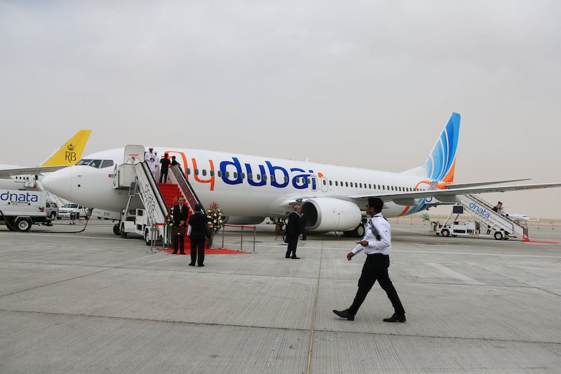 DUBAI, November 17, 2013 - Guests walk by the flydubai B737-700 BBJ  plane at the Dubai Air Show in Dubai, November 17, 2013.  (Photo by: Sarah Dea/The National, Story by: Lianne Gutcher, Business)


 *** Local Caption ***  SDEA171113-dubai_airshow_lianne21.JPG