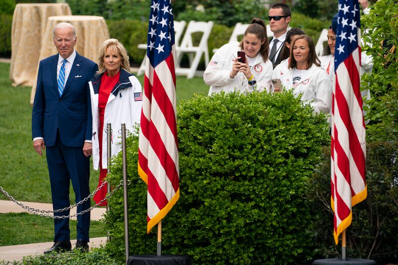 President Joe Biden and first lady Jill Biden wait to walk out with members of Team USA to celebrate their participation at the Tokyo 2020 Summer Olympic and Paralympic Games and Beijing 2022 Winter Olympic and Paralympic Games. AP