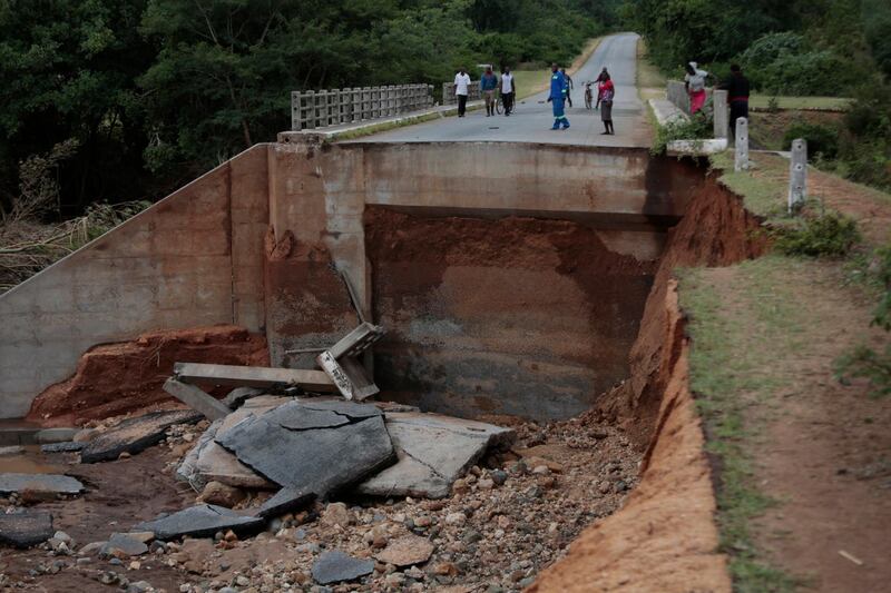 Members of the community walk near one of the many damaged roads and bridges in Chimanimani, 450 km east of the capital Harare, Zimbabwe after Cyclone Idai hit the area. Over 80 people have died, more than 100 still missing and thousands displaced as a result of the disaster. Neighbouring Mozaambique and Malawi have also have been affected by the cyclone.  EPA