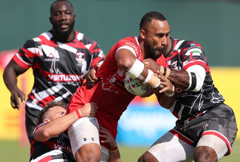 Tigers' Sakiusa Naisau is tackled.