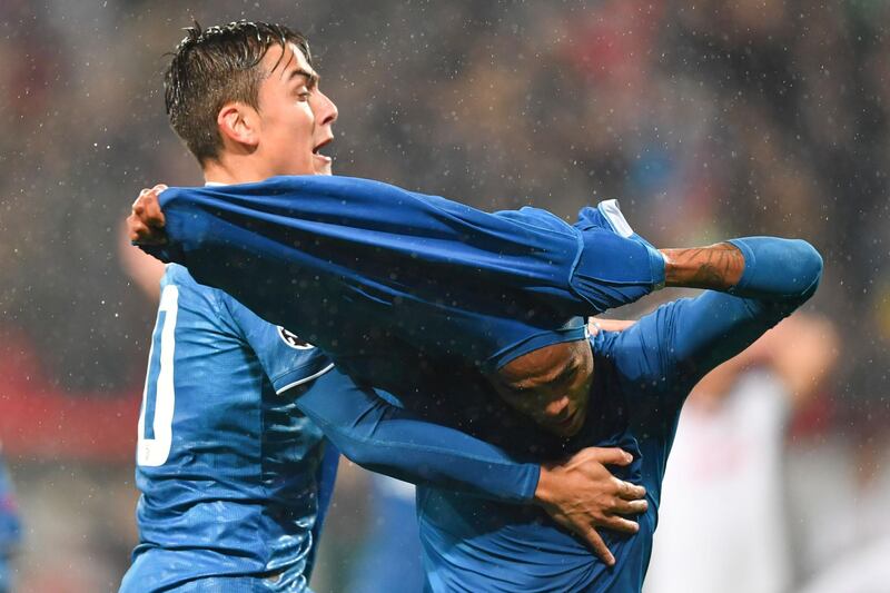 The celebrations start for Douglas Costa and Argentine forward Paulo Dybala after the winner. AFP