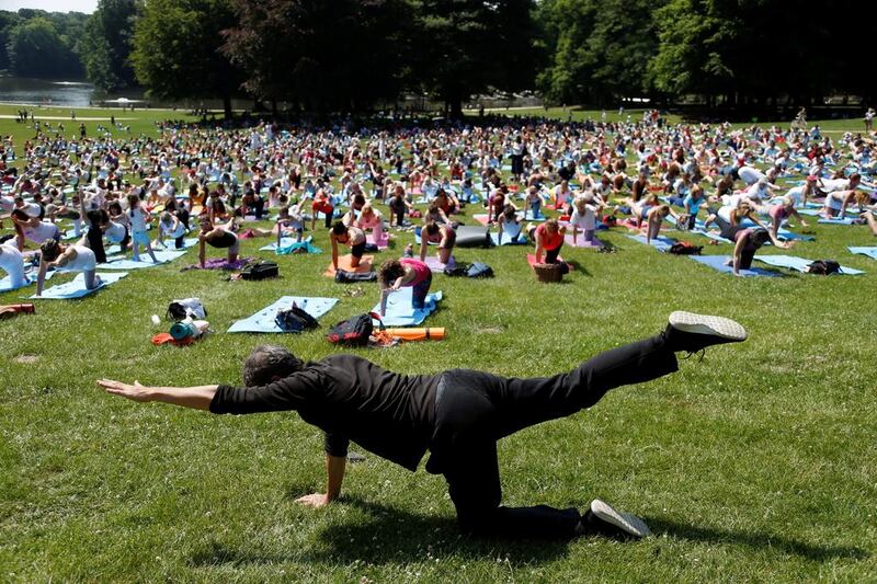 Participants perform yoga in a park ahead of International Yoga Day, in Brussels, Belgium. Francois Lenoir / Reuters