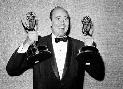 FILE - In this May 26, 1963 file photo, Carl Reiner shows holds two Emmy statuettes presented to him as best comedy writer for the "Dick Van Dyke Show," during the annual Emmy Awards presentation in Los Angeles. Reiner, the ingenious and versatile writer, actor and director who broke through as a â€œsecond bananaâ€ to Sid Caesar and rose to comedyâ€™s front ranks as creator of â€œThe Dick Van Dyke Showâ€ and straight man to Mel Brooksâ€™ â€œ2000 Year Old Man,â€ has died, according to reports. Variety reported he died of natural causes on Monday night, June 29, 2020, at his home in Beverly Hills, Calif. He was 98. (AP Photo, File)