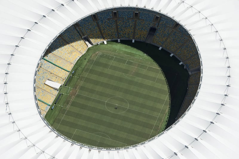 Aerial view of the Mario Filho (Maracana) stadium in Rio de Janeiro, Brazil, on December 3, 2013. The Maracana stadium will host the Brazil 2014 FIFA World Cup and the 2016 Summer Olympics. AFP PHOTO / YASUYOSHI CHIBA   JAPAN OUT
 *** Local Caption ***  475183-01-08.jpg