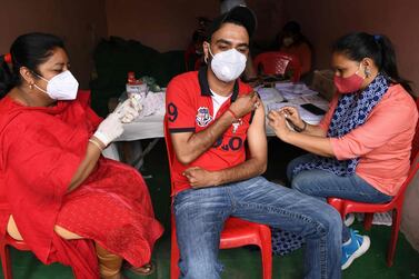 A man receives a Covid-19 vaccine as part of the Covax initiative, in Amritsar, India. AFP