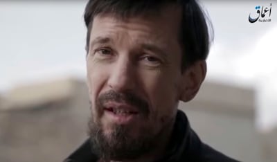 FILE - This file image taken from video released on Wednesday Dec. 7, 2016 by the Islamic State's Amaq news agency, shows captive British photojournalist John Cantlie in what appeared to be central Mosul, Iraq. British Security Minister Ben Wallace told journalists on Tuesday Feb. 5, 2019, that the government believes British hostage John Cantlie is alive and believe he is being held by Islamic State operatives. (Islamic State's Amaq News Agency via AP, File)