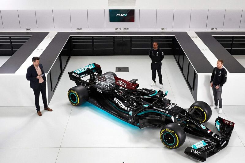 Mercedes drivers Lewis Hamilton and  Valtteri Bottas unveil Mercedes' car for the 2021 season. AFP