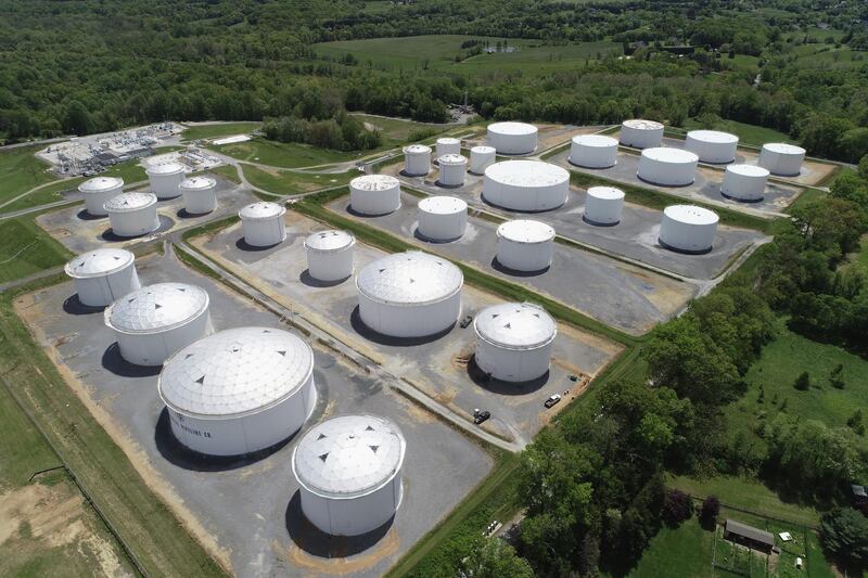 Holding tanks are seen in an aerial photograph at Colonial Pipeline's Dorsey Junction Station in Woodbine, Maryland. A ransomware attack on the 2.5 million barrels per day Colonial Pipeline has endangered access to fuel for the US East Coast. Reuters