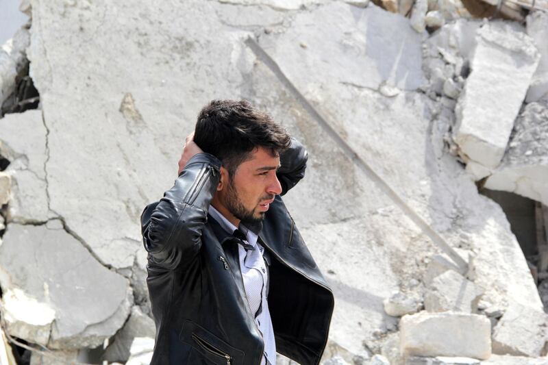 A man reacts to the destruction of his home following a reported air strike by government forces on the northern Syrian city of Aleppo on February 22, 2014. More than 140,000 people have been killed in Syria's conflict since March 2011, and millions more have fled their homes. AFP PHOTO/MOHAMMED AL-KHATIEB (Photo by MOHAMMED AL-KHATIEB / MOHAMMED AL-KHATIEB / AFP)