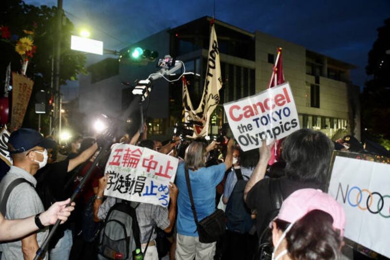 Protesters outside the Japan National Stadium before the closing ceremony of the Tokyo Olympic Games.