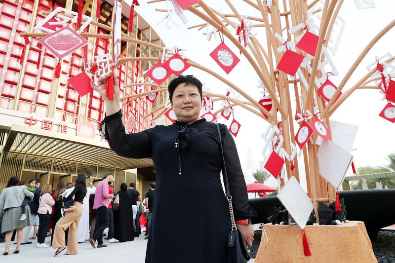 Dr Liu Yanhui, director of the Confucius Institute, taught young children to sing songs in Mandarin for the Expo 2020 Dubai performance. Pawan Singh / The National