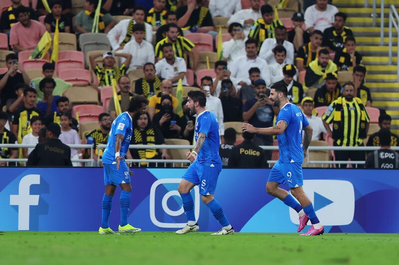 Yasser Al-Shahrani celebrates with teammates after scoring Al Hilal's first goal against Al Ittihad. Getty Images