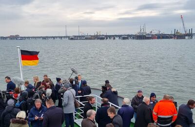 Politicians and people involved with the LNG project take a boat ride to the terminal in Wilhelmshaven, Germany. Tim Stickings/The National
