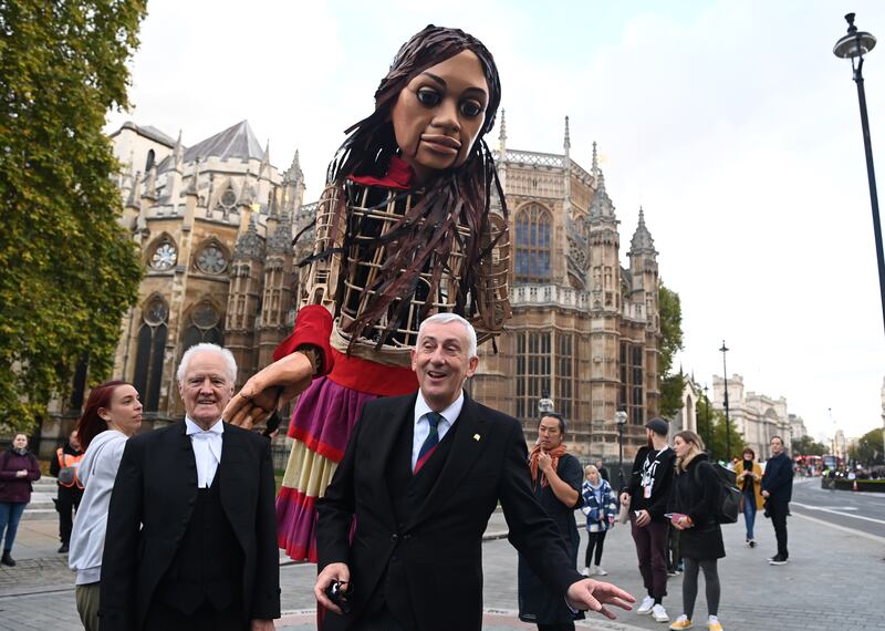 Little Amal meets the Speaker, Sir Lindsay Hoyle, outside the Houses of Parliament in London. EPA