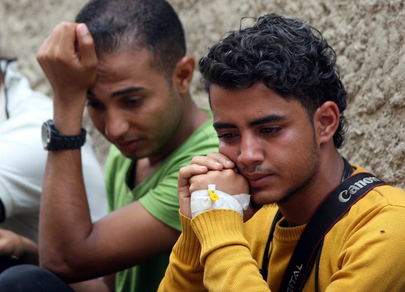 Journalists sit during the funeral of fellow journalists Wael Al Absi and Taqiaddin Al Hudhaifi who were killed by a shell as they were covering fighting between Houthi fighters and pro-government fighters in Taiz, Yemen on May 26, 2017. Anees Mahyoub / Reuters